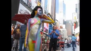 Andy Golub body paints model Tynisha Eaton in Times Square