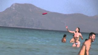 Topless Frisbee beach girl