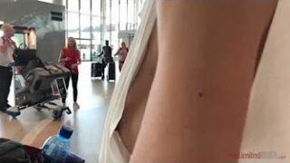 Nipple slips no bra at the airport