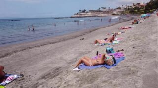 Spanish beach topless sunbathing women