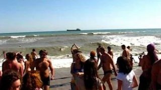 Tiny topess dancer on a Crimean beach at 1:28