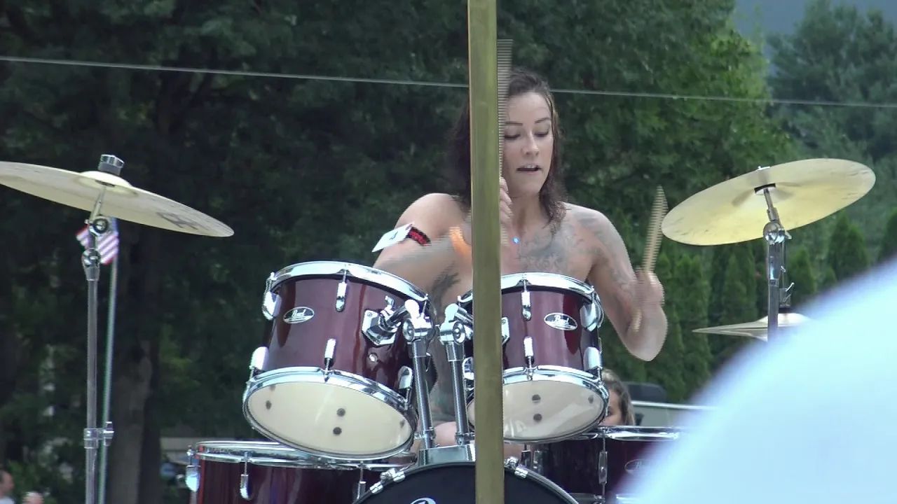 wife playing drums naked