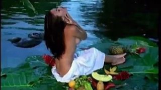 Exotic chick gets naked and pleasures herself with a mango.