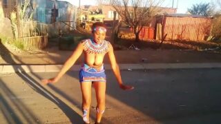 Blackgirl practicing ritual dance whilst her uncle recorded