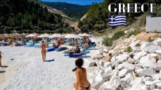 Greece beach walk, topless beauty