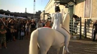Naked white bunny-girl rides a white horse in “L’Anno Del Coniglio Bianco. By Franco Losvizzero 2011-Performance. Macro Museum”