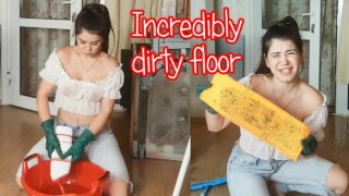 Cleaning the floor in a wet T-Shirt
