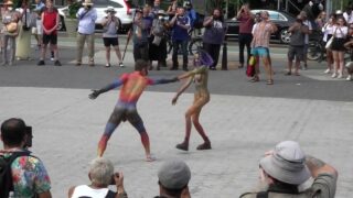 Thin bodypainted girl shows off her naked body in public