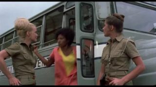 Lesbian voyeur watches women shower at 5:00 in “Black Mama, White Mama (1973)”