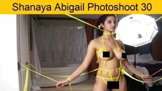 She’s wearing only yellow caution tape in “Shanaya Abigail Photoshoot 30”