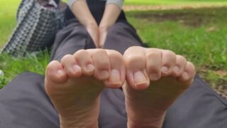 Tutor scrunches her long Japanese toes in the park
