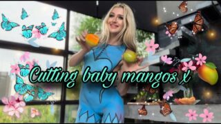 Cutting Mango in Blue Ice Girl Body Paint Style at 0:00