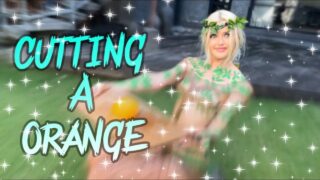 Cutting an Orange in Body Art: A Creative Slice of Color at 0:00