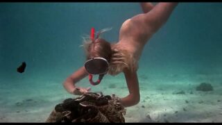 Beautiful woman swimming naked underwater