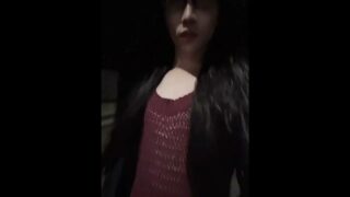 Asian Crossdresser walking outdoor in the midnight with see through dress