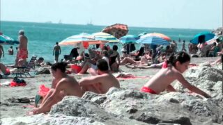 Topless lady from 0:00 until 0:43 on the beach