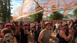 Topless hippie girl at 2:13 on Ozora festival