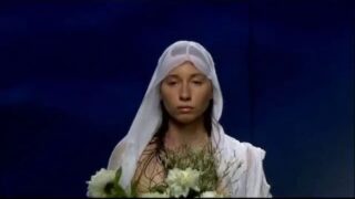 Absurd fashion show with a few topless models beginning at 2:42
