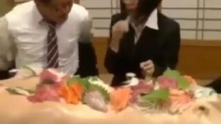 naked woman on the table amidst the food Starts 00:00