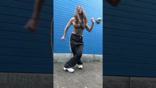 Dancing in a mesh top, no bra