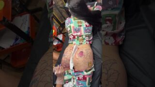 Girl getting a tattoo on her sexy ass